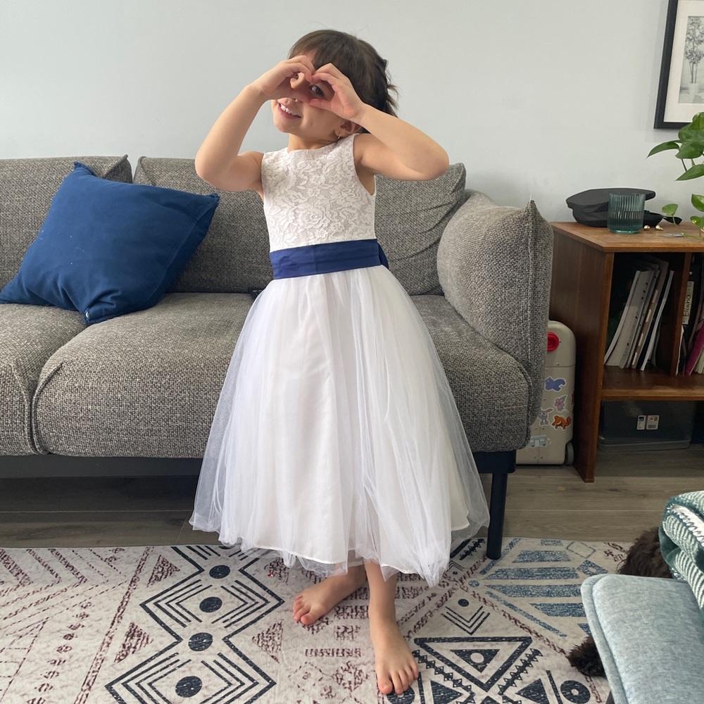 White flower girl dress with royal blue ribbon belt